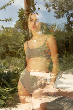 woman brown bikini reflecting glass